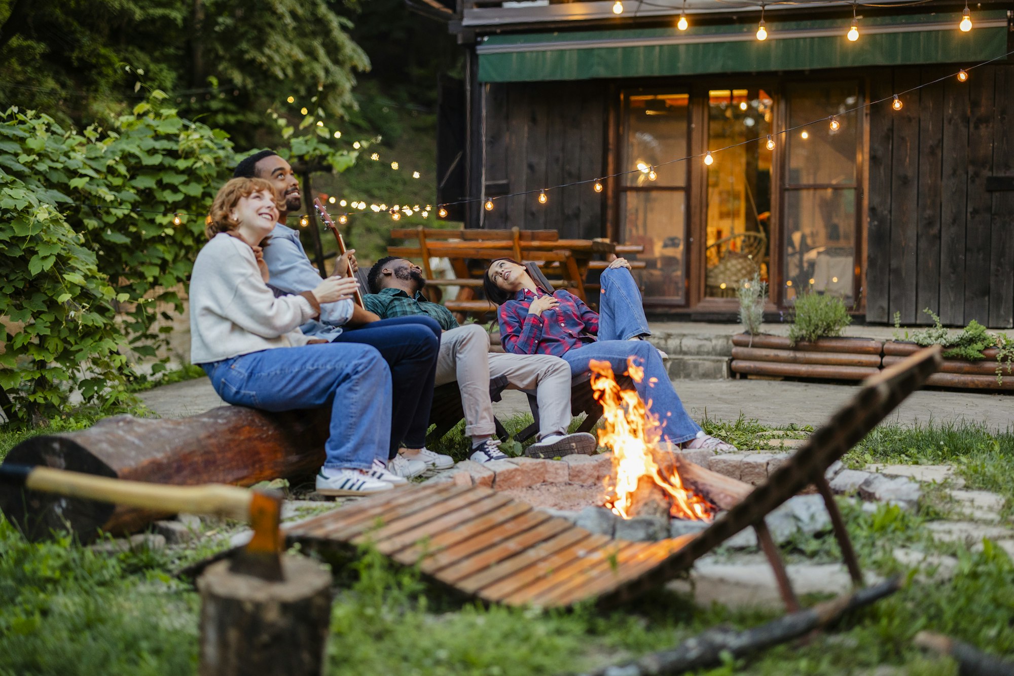 Friends Enjoying a Campfire Evening at a Rustic Retreat